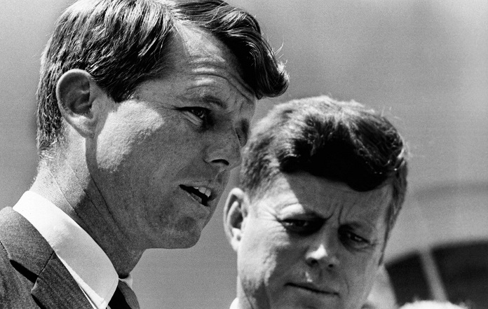 President John Kennedy and Attorney General Robert Kennedy during ceremonies honoring the bravery of young African Americans. A JFK Destiny Betrayed